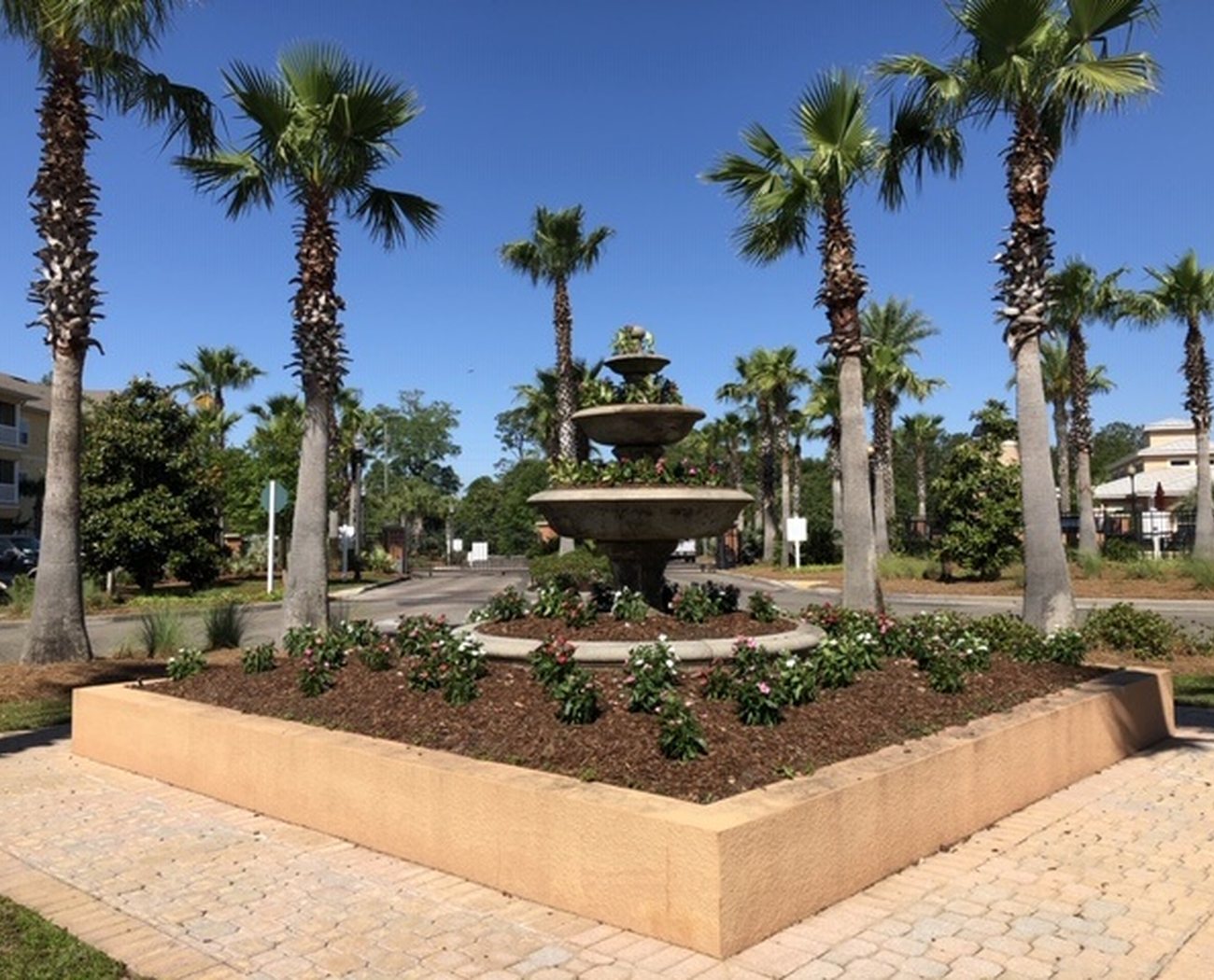A large, freshly mowed commercial lawn maintained by Edrington Greenscapes
